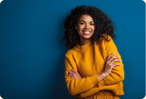 Confident Smiling Businesswoman In A Yellow Sweater Representing The Many Companies Still Successfully Running Dynamics NAV Today